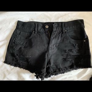 black ripped shorts